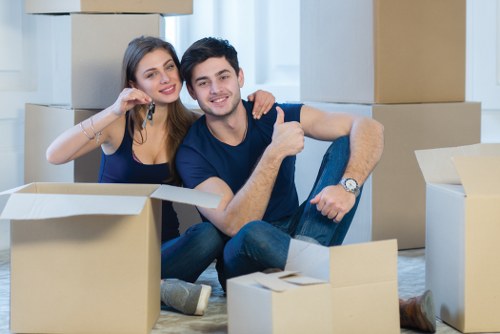 Furniture pick-up service removing a sofa in Westminster