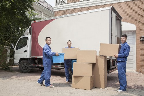 Moving van loading boxes and furniture in Westminster residential street