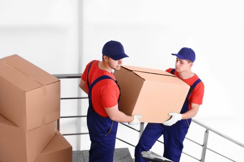Packed moving boxes and furniture ready for Westminster removals