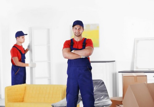 Professional movers carrying out a careful and controlled move