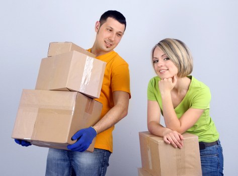 Removal crew loading items carefully into a moving van