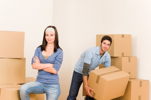 Specialist movers handling a grand piano through a Westminster property